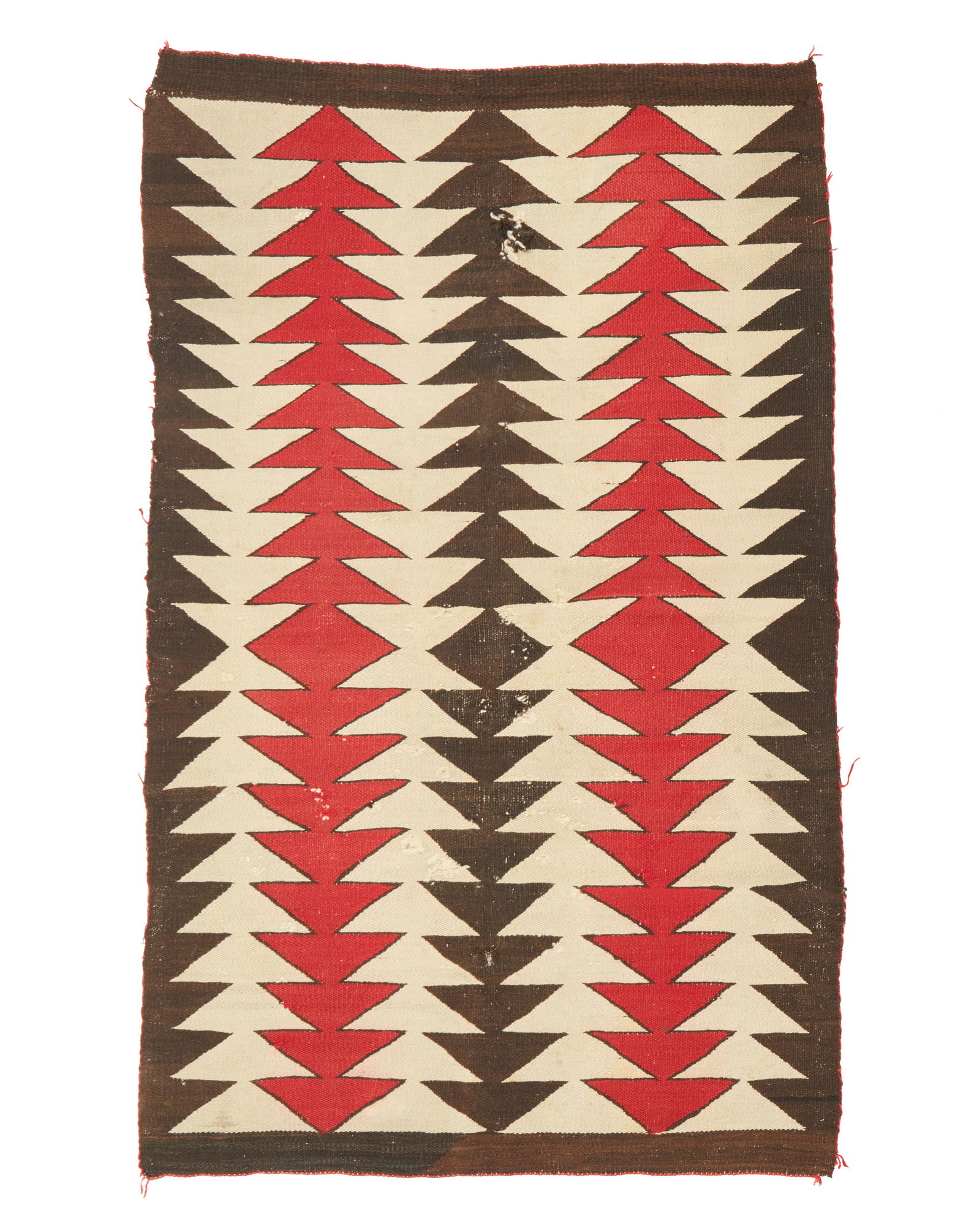 A Navajo regional rug: A Navajo regional rugMid-20th century, DineWoven in red, cream, and black wool with stacked sawtooth columns in alternating colors63" H x 36" W