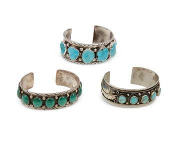 Three Southwest-style silver and set stone cuff bracelets