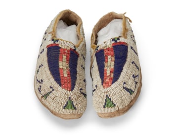 A pair of Sioux beaded and quilled hide moccasins