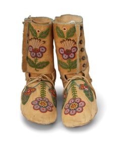 A pair of Blackfoot beaded hide high-top moccasins
