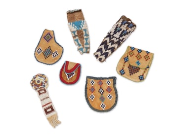 A group of Plains beaded hide bags and pouches