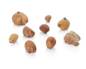A group of Zuni carved tagua nut and stone fetish figures