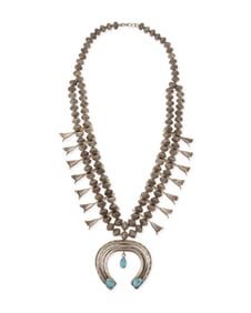 A Southwest sterling silver and turquoise squash blossom necklace