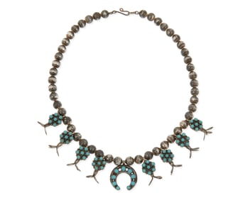 A Navajo sterling silver and turquoise squash blossom necklace