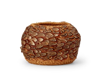 A pine needle and feather basket