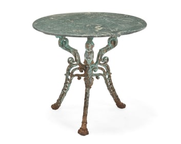 A wrought-iron and marble garden table