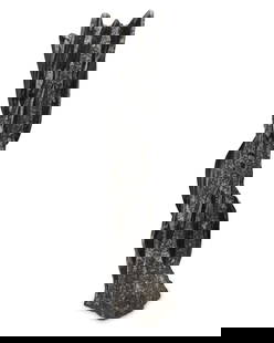 An orthoceras fossil tower specimen: An orthoceras fossil tower specimen20th/21st centuryComprising approximately seventeen orthoceras cephalopod fossils, each polished in relief within a chisel-prepared matrix26&quot; H x 7&quot; W x 6.