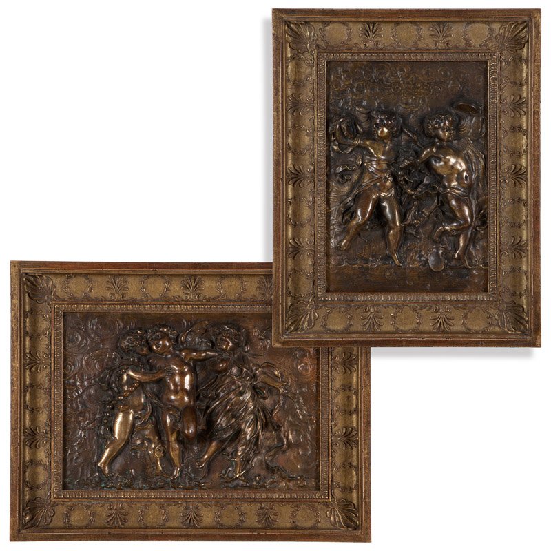 Two framed gilt-bronze relief plaques: Each late 19th century, depicting putti frolicking, the first oriented vertically, the second oriented horizontally, within later gilt wood frames, 2 pcs, the first 22.5'' H x 17.25'' W; the second 19