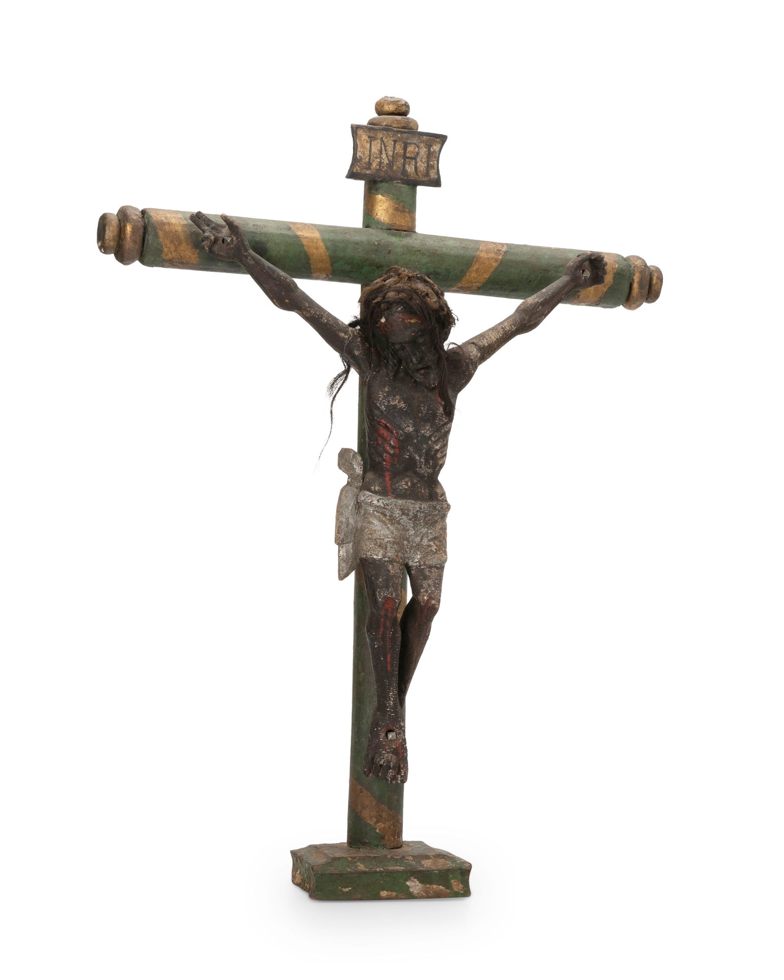 A Latin American Cristo figure: A Latin American Cristo figure19th centuryThe Spanish Colonial painted carved wood crucifix mounted with hair and fabric to figure's head27.5" H x 20.25" W x 6.5" D