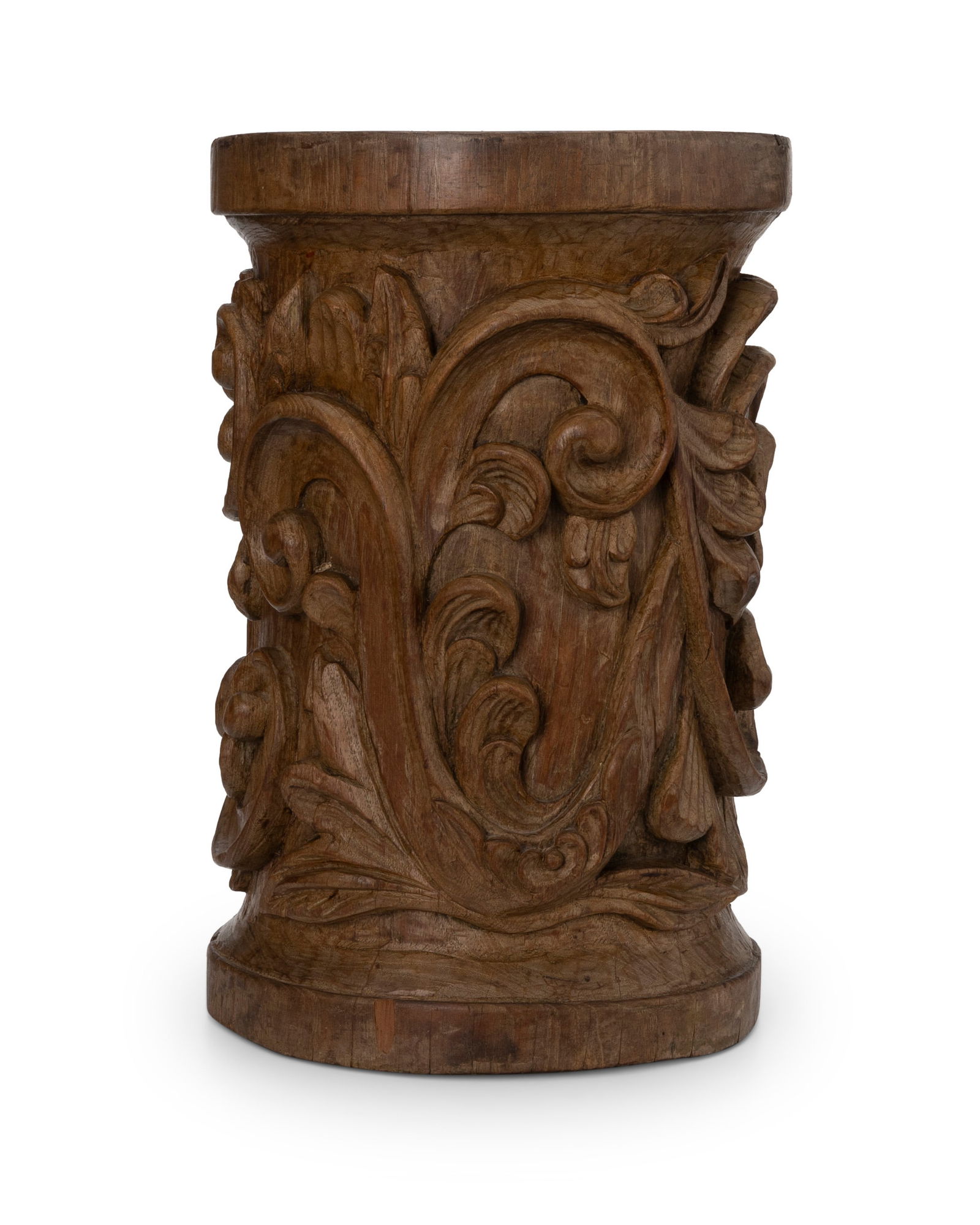 A Spanish Colonial carved wood pedestal: A Spanish Colonial carved wood pedestal18th/19th centuryWith scrolled foliate motifs15.5" H x 10.25" Dia.