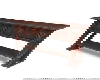 A Spanish Colonial-style console table: A Spanish Colonial-style console table2003Stamped verso: Taber / CO / 2003The Taber & Co. antiqued wood table with three drawers above an undershelf, with carved scrolled accents throughout32.5"