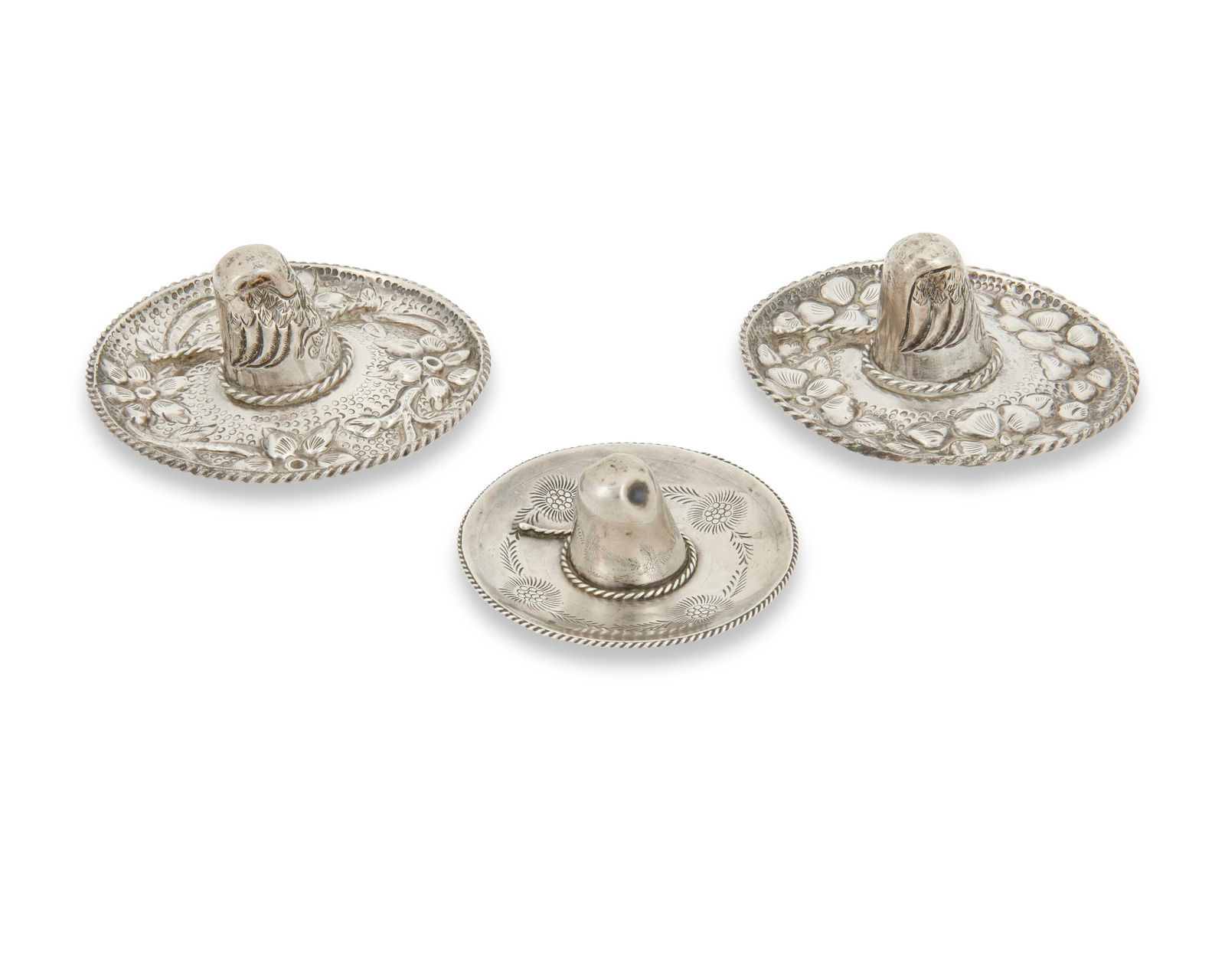 Three Mexican sterling silver sombrero ring holders: Three Mexican sterling silver sombrero ring holdersEarly/mid-20th century; Mexico City, MexicoTwo marked: Sanborns / Mexico / Sterling; one marked: Plateria Alejo / Mexico / 925Each ring dish in the f