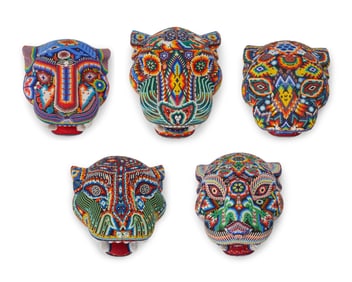 A group of Huichol beaded jaguar masks