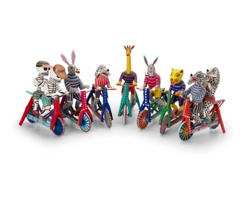 A group of Martin Melchor Angeles alebrijes bicycle figures
