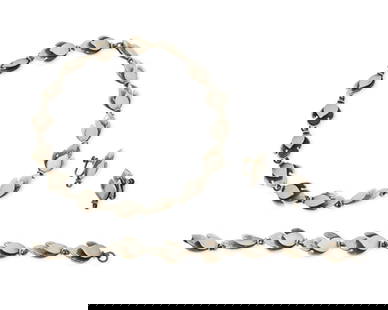 A set of Mexican sterling silver jewelry: A set of Mexican sterling silver jewelryMid-20th centuryEach marked: Sterling / Made in Mexico / 200 [likely design number]Three works comprising a sterling silver leaf-form link necklace together wit