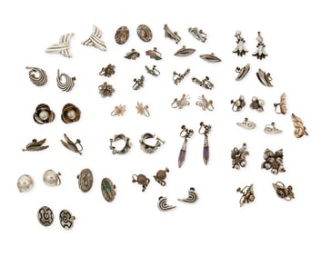 A large group of Mexican silver earrings
