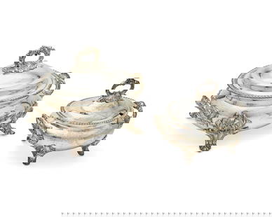 Two English silver-plated soup tureens: Two English silver-plated soup tureens19th centuryOne with Sheffield marksComprising two footed covered tureens, one with shell-form handles, the other with foliate-form handles, each lid with gadroon