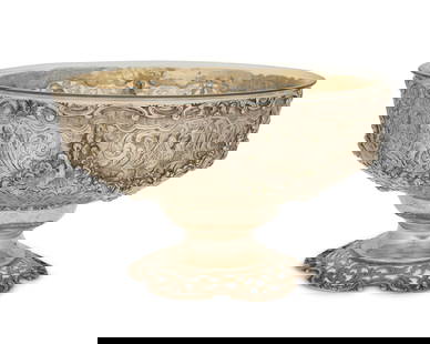 A German .800 silver pierced footed bowl: A German .800 silver pierced footed bowl19th/early 20th centuryWith German hallmarks and marked: 800Decorated with repousse swags and birds, with a glass liner6.875" H x 11" Dia.Weighable sterling: 31