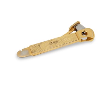 An Elizabeth II 14K gold-mounted cigar cutter