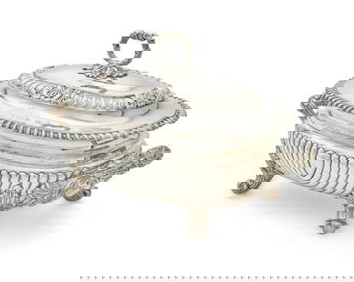 An English Sheffield silver-plated tureen: An English Sheffield silver-plated tureen18th centuryWith the mark of Matthew BoultonOf oval form, with gadrooning and shell decoration, the cover bearing an engraved armorial10" H x 16.5" W x 10" D P