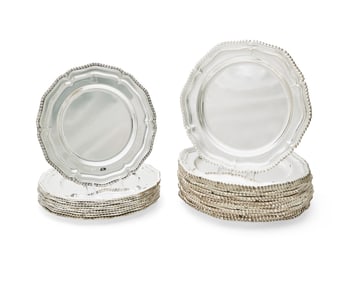 A group of Neoclassical-style silver-plated chargers
