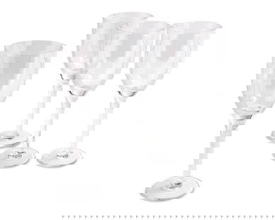 A set of twenty Lalique glass 'Ange' champagne flutes: A set of twenty Lalique glass 'Ange' champagne flutesLate 20th/early 21st centuryEach etched: Lalique trademarked France20 piecesEach: 8.125" H Provenance:From the Collection of Robert A. Day