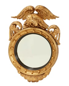 A Regency carved giltwood convex mirror