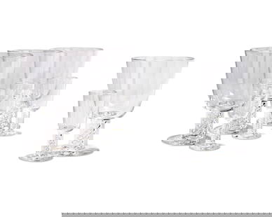 A suite of Steuben glass stemware: A suite of Steuben glass stemware20th centuryEtched: SteubenEach featuring air twist stems, comprising sixteen 5.75" water goblets and sixteen 3.875" cordials32 piecesProvenance:From the Collecti