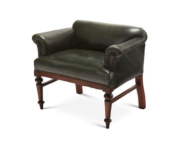 A George IV-style leather upholstered mahogany low chair