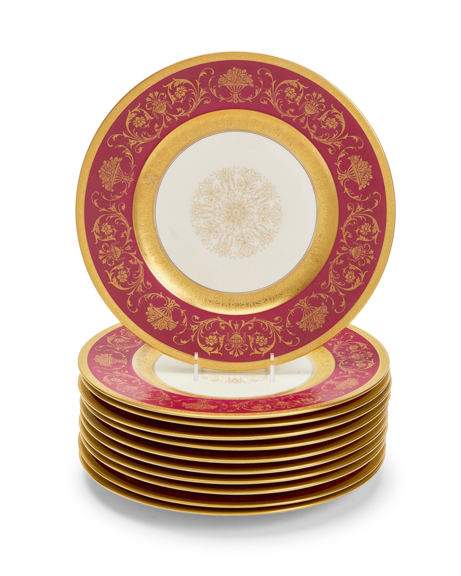 A set of eleven Bavarian porcelain dinner plates: A set of eleven Bavarian porcelain dinner plates20th centuryEach stamped to underside: K & A / Krautheim / Selb BavariaEach with gilt and cranberry rim11 piecesEach: 10.875" Dia. Provenance:From