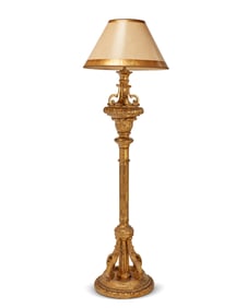 A Baroque-style carved giltwood floor lamp