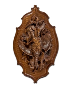 A Continental carved wood wall plaque