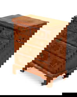 A George II-style burl walnut bachelor's chest: A George II-style burl walnut bachelor's chest19th centuryThe folding top above two short and three long drawers, on bracket feet28" H x 24" W x 13" D Provenance:From the Collection of Robert A. Day
