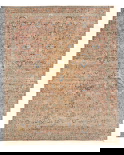 A Kerman rug: A Kerman rugCirca 1910; Southeast PersiaThe wool on cotton foundation rug having a claret field with an allover palmette trellis within a similar claret floral vinery border20' 3" L x 16' 8" W Provena