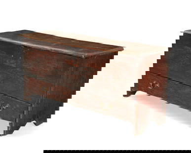 An English oak blanket chest: An English oak blanket chest18th centuryCarved recto: NT 1719With a hinged locking lift-top opening to reveal an interior till and later moire lining, above a single drawer, with boot jack-style sides
