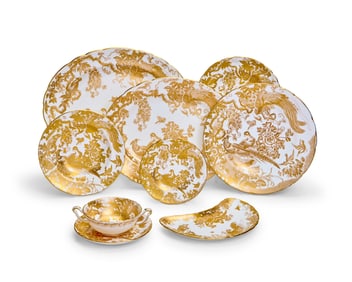 A Royal Crown Derby porcelain 'Gold Aves' part dinner service