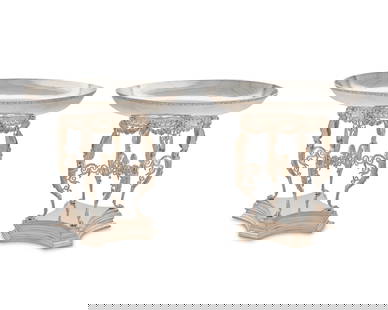 A pair of large English Etruscan-style silver-plated centerpieces: A pair of large English Etruscan-style silver-plated centerpieces1929With mark of Elkington & Co. and date mark; numbered: 29274Retailed by J. Lyons & Co., Ltd., each with a shallow oval bowl resting