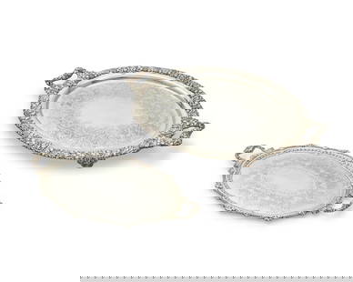Four large silver-plated handled oval serving trays: Four large silver-plated handled oval serving traysLate 19th/20th centuryTwo with Sheffield plate marks; one marked: Gorham EPNS / Y1107; another marked: T & AEach handled tray with central chased scr