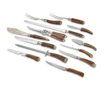 A group of silver plate-mounted antler-handled steak knives and serving utensils