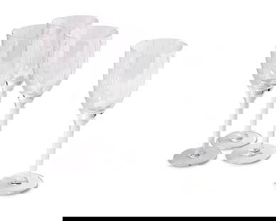 A set of twenty Lalique glass 'Ange' champagne flutes: A set of twenty Lalique glass 'Ange' champagne flutes20th centuryEach etched: Lalique trademarked France [post-1978]20 piecesEach: 8.125" H Provenance:From the Collection of Robert A. Day