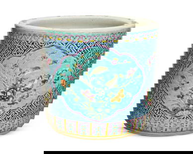 A Chinese polychrome porcelain jardiniere: A Chinese polychrome porcelain jardiniere20th centuryDecorated with birds, flowers, and butterflies on a turquoise ground12.5" H x 14" Dia. Provenance:From the Collection of Robert A. Day