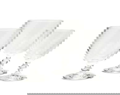 A suite of Steuben clear glass stemware: A suite of Steuben clear glass stemwareLate 20th/early 21st centuryEach etched: SteubenComprising ten Steuben glass 5.25" water goblets and four Steuben glass 4.5" claret glasses14 piecesEach goblet: