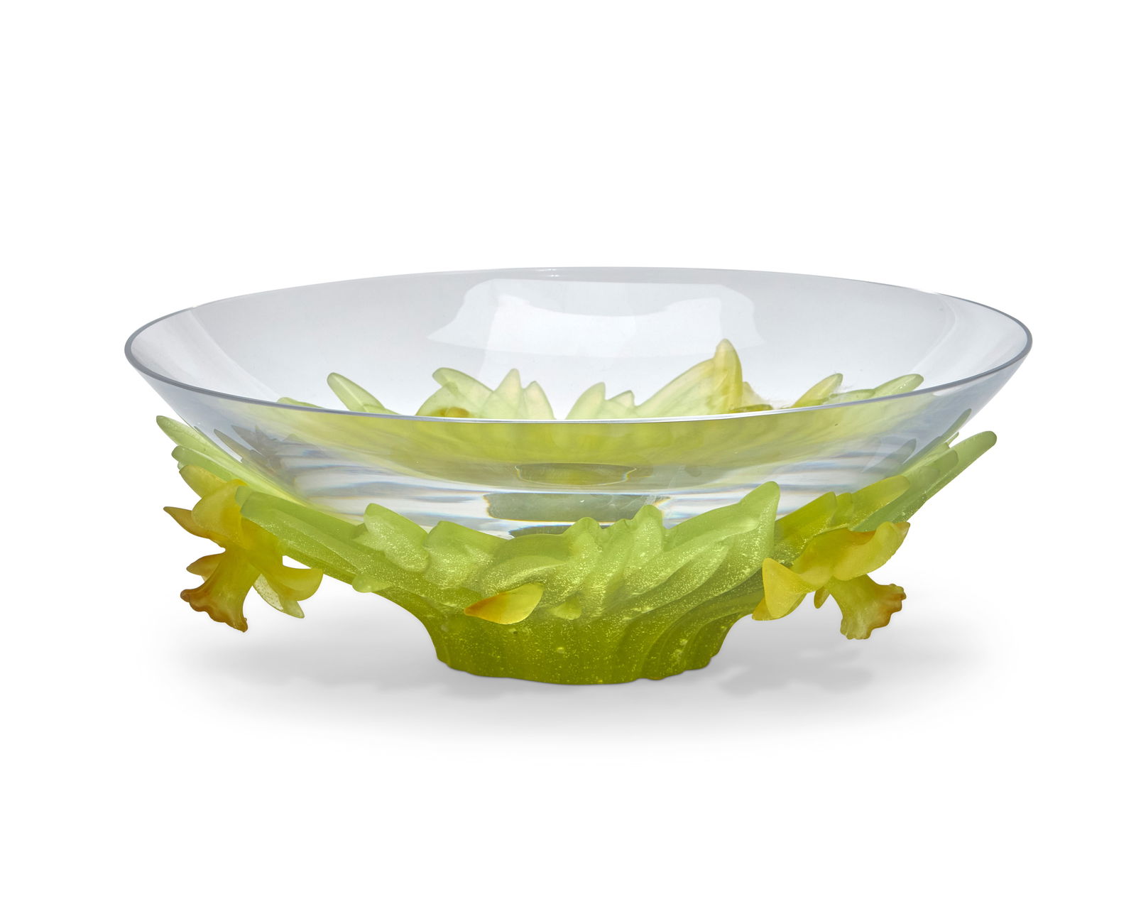 A Daum pate-de-verre bowl: A Daum pate-de-verre bowlLate 20th/early 21st centurySigned and inscribed: Daum / FranceThe clear glass bowl set in a green and yellow p‚te-de-verre daffodil base4.25" H x 12" Dia. Provenance:From t