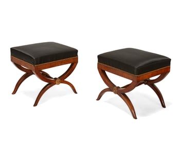 A pair of Empire-style parcel-gilt mahogany curule stools