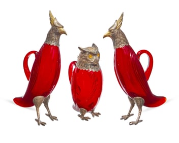 A group of Spanish silver-plate-mounted ruby glass bird-form decanters