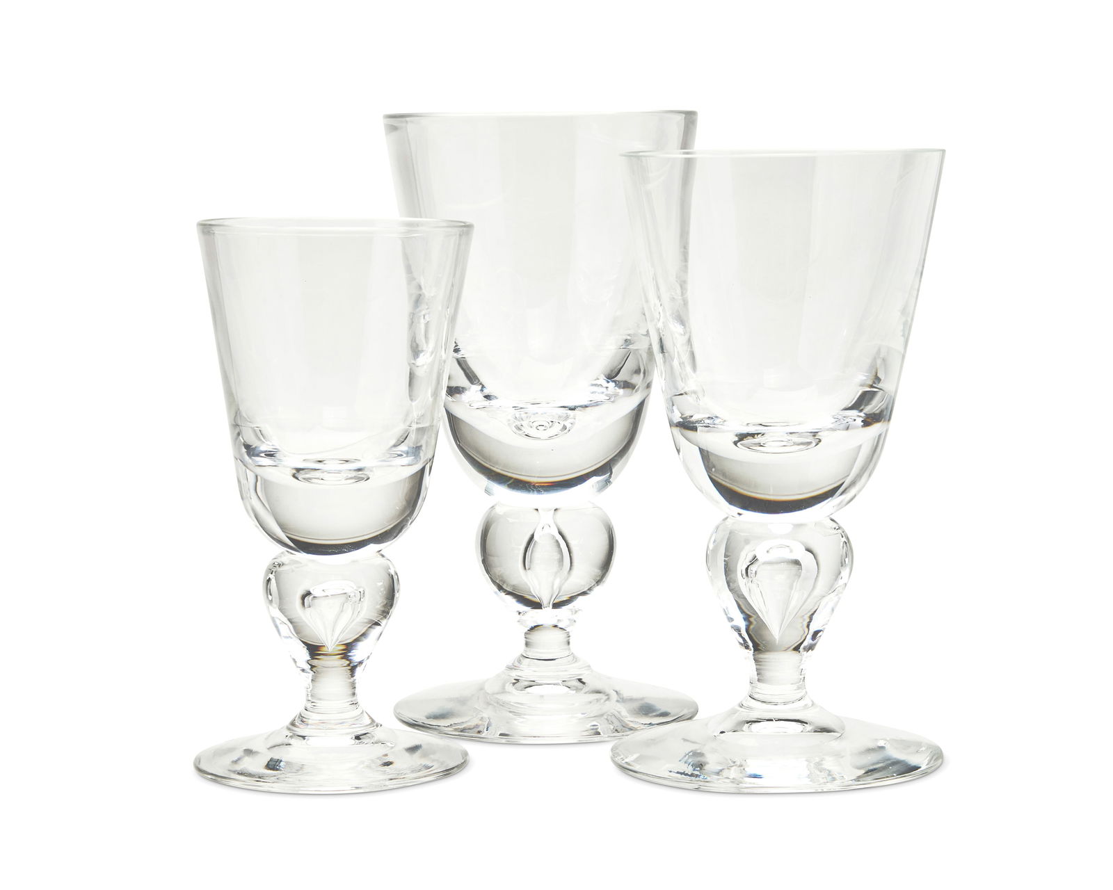 A Steuben clear glass stemware service: A Steuben clear glass stemware serviceLate 20th/early 21st centuryEach etched: SteubenEach with bulbous stems with encased teardrops, comprising forty 6.75" wine glasses and five 5.625" wine glasses45