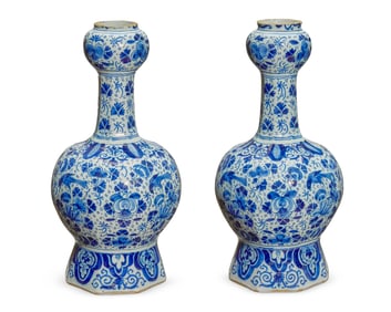 A pair of Delft blue and white pottery garlic-head vases