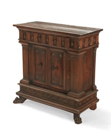 An Italian carved walnut credenza