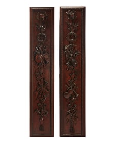 A pair of George III-style carved wood panels