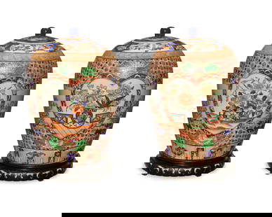 A pair of Chinese porcelain covered vases: A pair of Chinese porcelain covered vases20th centuryEach bearing a red apocryphal reign mark to underside; one with a partial Macau stickerEach lidded vase with floral bunches within cordiform frieze